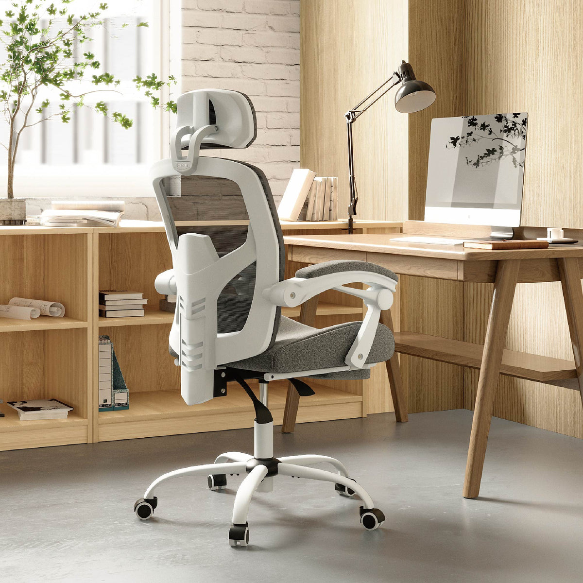 Reclining ergonomic office chair with footrest